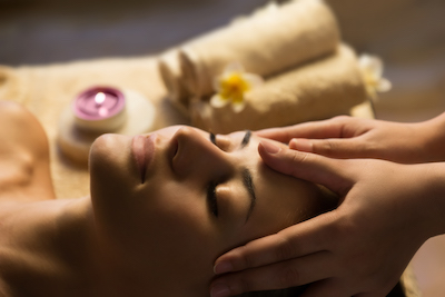 woman receiving spa facial